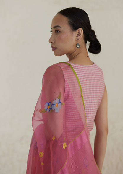 Handloom organza mulberry silk jamdani saree in carnation pink, from Surmaye. Intricate all-over floral motifs. Paired with designer blouse with pink gingham checks. 