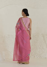 Handloom organza mulberry silk jamdani saree in carnation pink, from Surmaye. Intricate all-over floral motifs. Paired with designer blouse with pink gingham checks. 