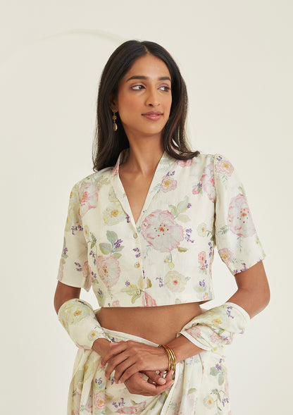 Designer ivory blouse from Surmaye, made with handwoven mulberry silk. Hand-drawn floral print and a collared shirt silhouette.