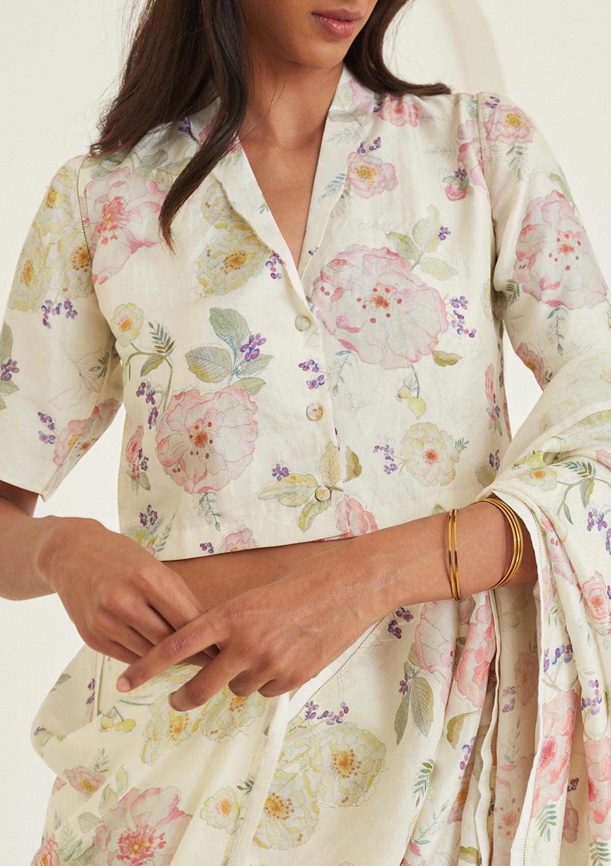 Designer ivory blouse from Surmaye, made with handwoven mulberry silk. Hand-drawn floral print and a collared shirt silhouette.