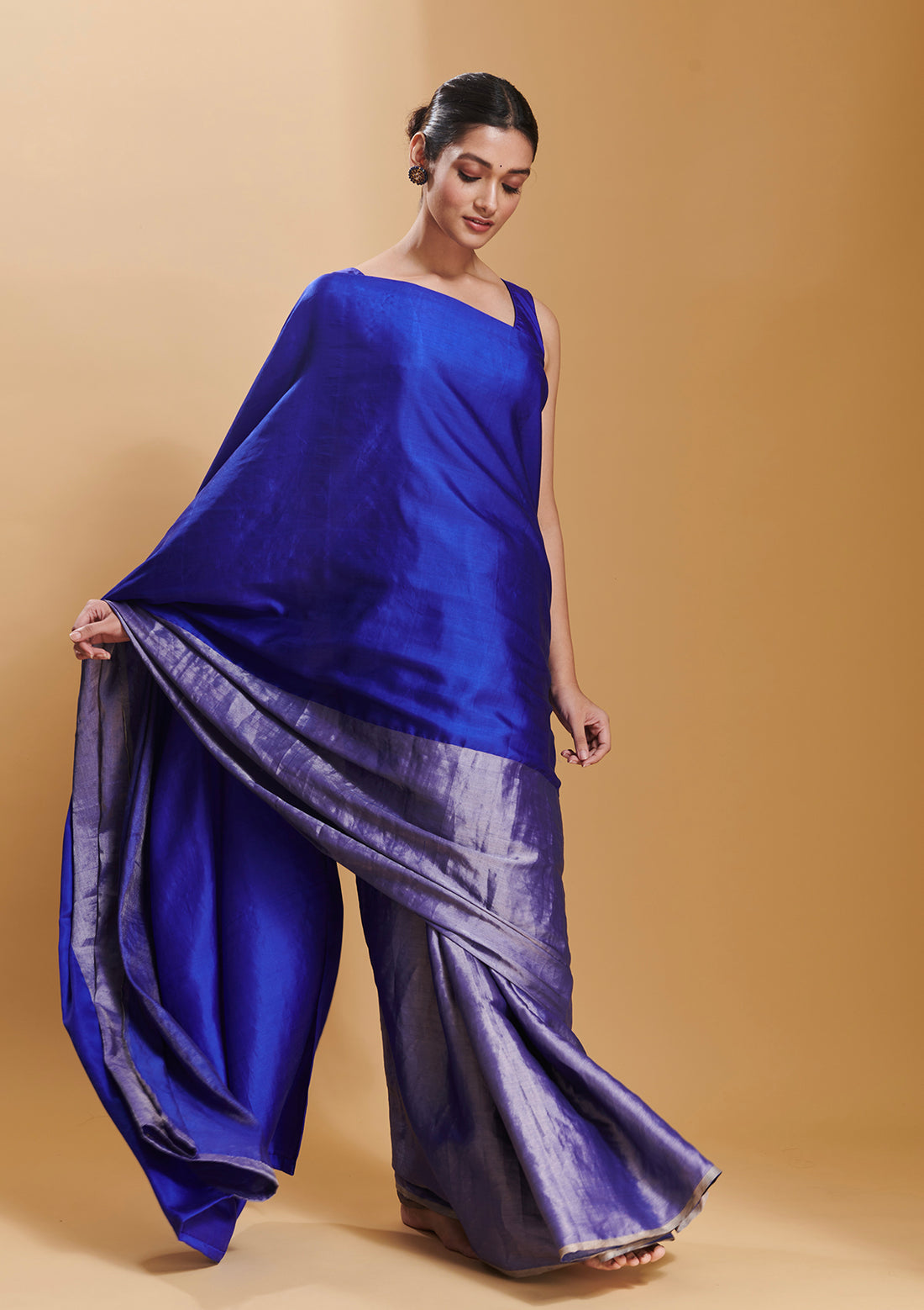 Blue handloom saree from Surmaye, made with mulberry silk satin. Broad zari border at the bottom of the saree. Ideal for festivities.