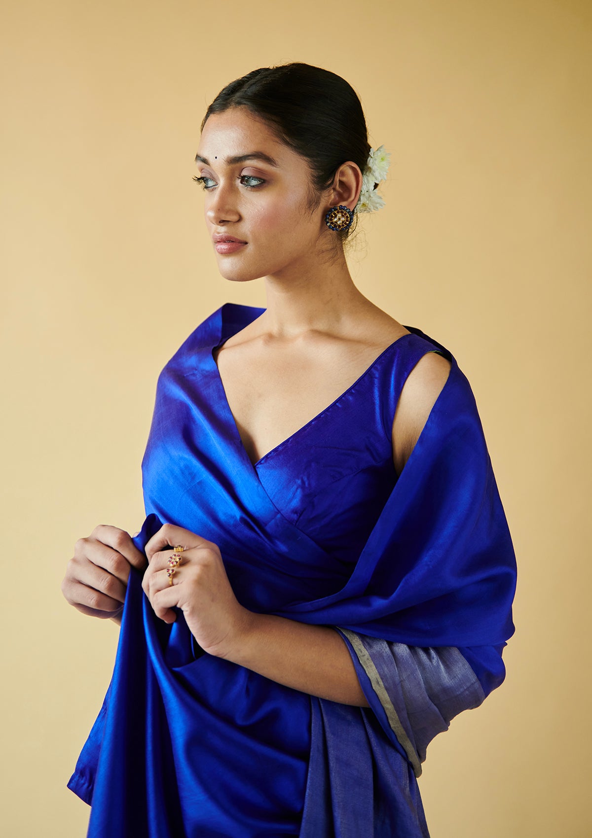 Blue handloom saree from Surmaye, made with mulberry silk satin. Broad zari border at the bottom of the saree. Ideal for festivities. 