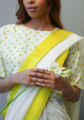 Designer ivory blouse, in a t-shirt silhouette from Surmaye. Yellow rose print on a soft mulberry silk base.