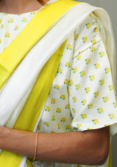 Designer ivory blouse, in a t-shirt silhouette from Surmaye. Yellow rose print on a soft mulberry silk base.