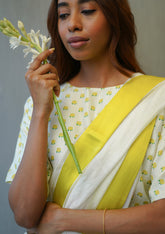 Designer ivory blouse, in a t-shirt silhouette from Surmaye. Yellow rose print on a soft mulberry silk base.