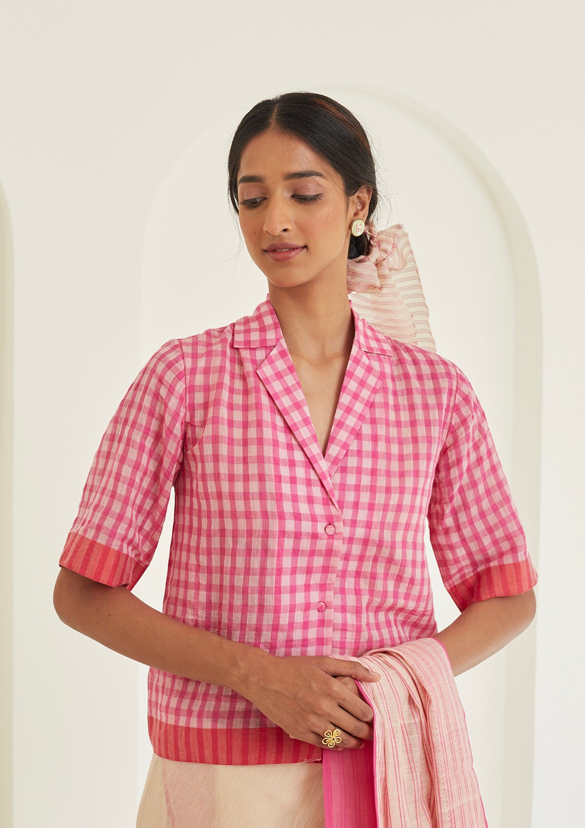 Pink designer blouse in softest handwoven silk khadi, from Surmaye. Gingham checks pattern in a shirt silhouette. 