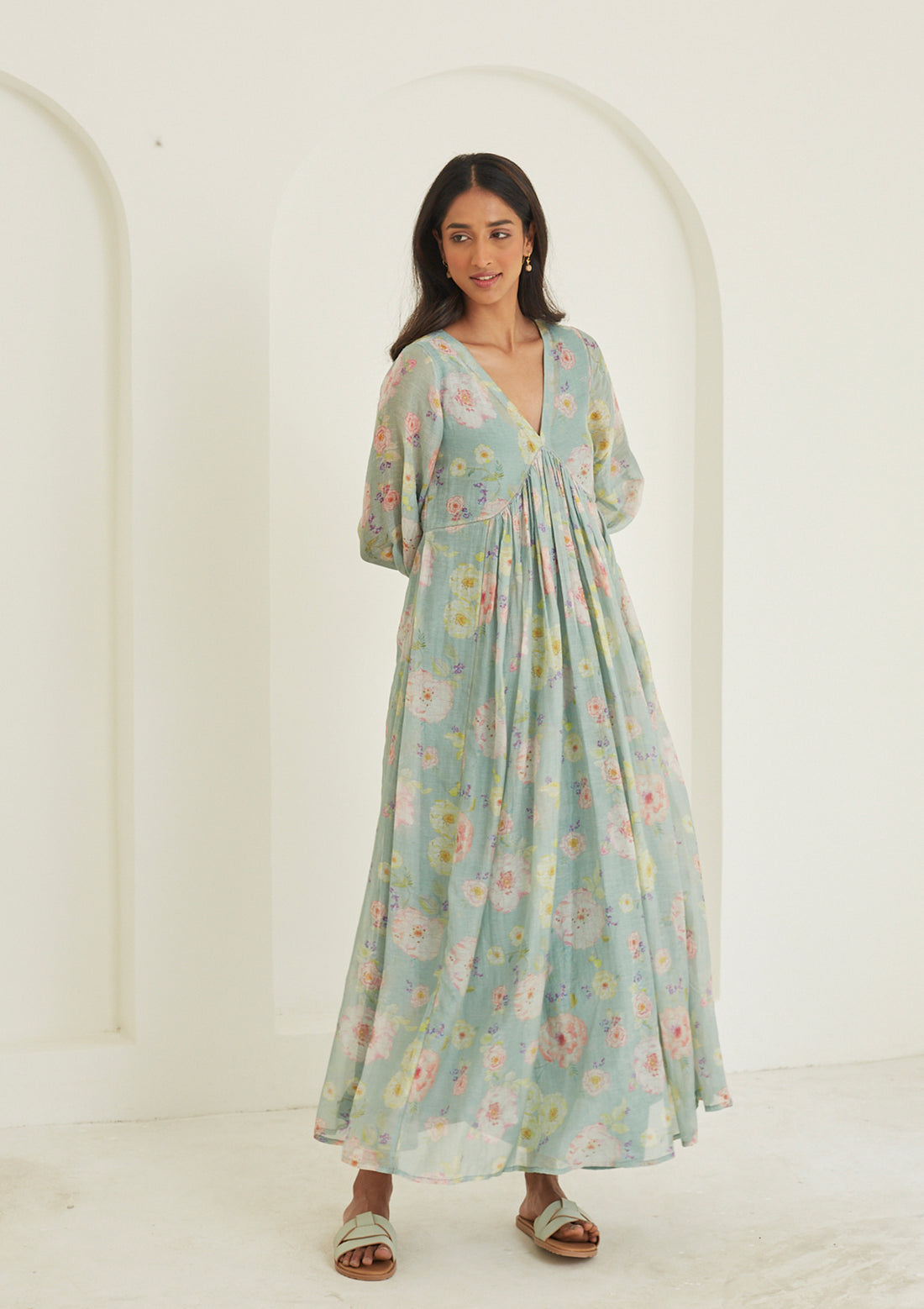 Handwoven maxi dress in sooti chanderi, from Surmaye. Sage green dress with hand-painted floral print, and a v-neck.