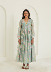 Handwoven maxi dress in sooti chanderi, from Surmaye. Sage green dress with hand-painted floral print, and a v-neck. 