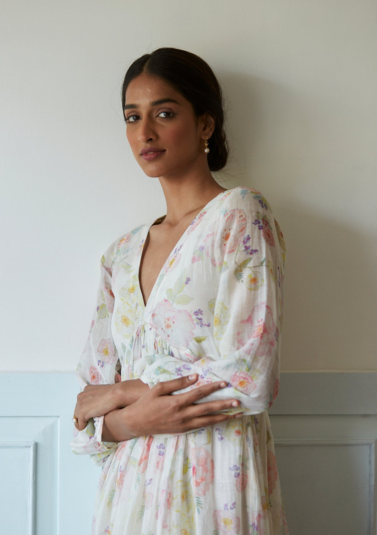 Handwoven maxi dress in sooti chanderi, from Surmaye. Ivory dress with hand-painted floral print, and a v-neck. 