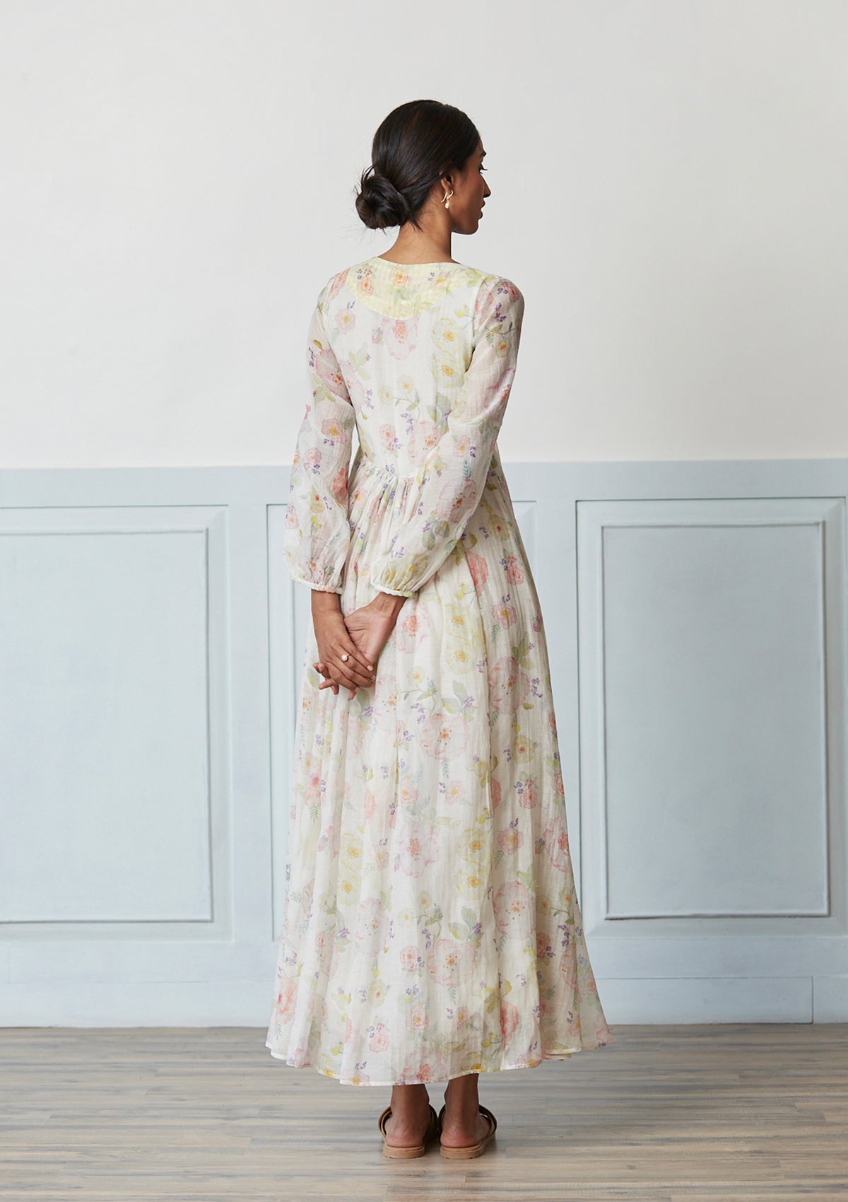 Handwoven maxi dress in sooti chanderi, from Surmaye. Ivory dress with a hand-painted floral print. 