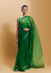 Green handloom silk organza jamdani saree, from Surmaye. Adorned with all-over jamdani weave dots. 